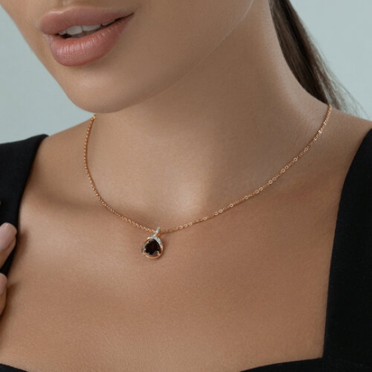 Подвеска из серебра с позолотой, гранатом и фианитами